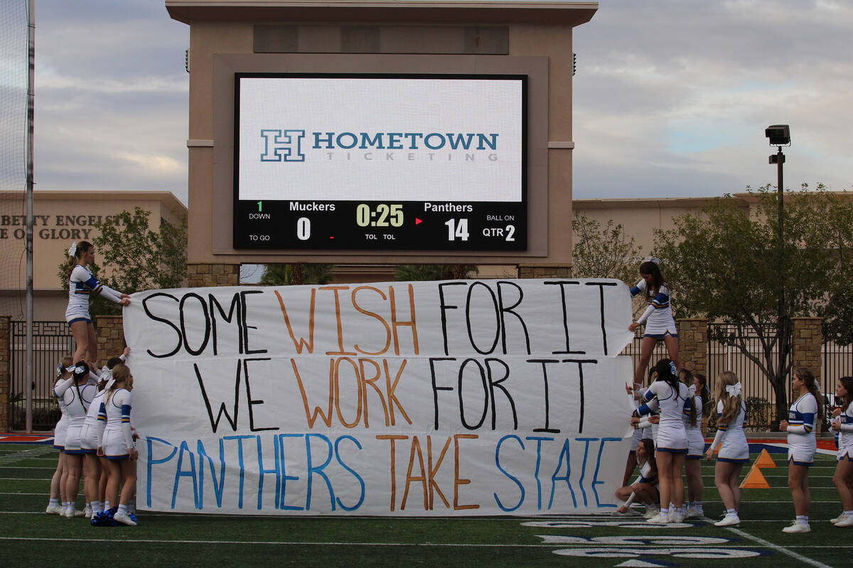 Members of the Pahranagat Valley High School cheer squad presented a personal banner for the te ...