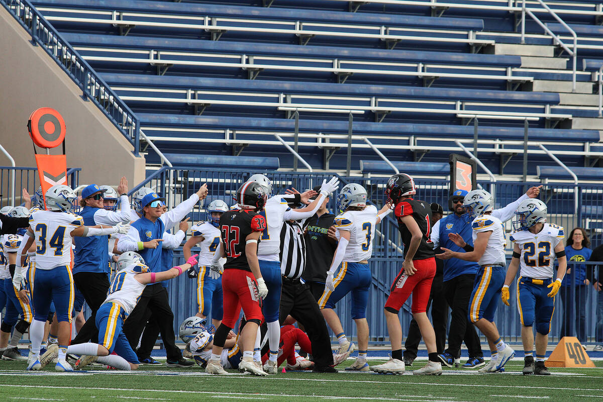 Pahranagat Valley argues for possession of the ball during a rare fumble by Tonopah's junior st ...