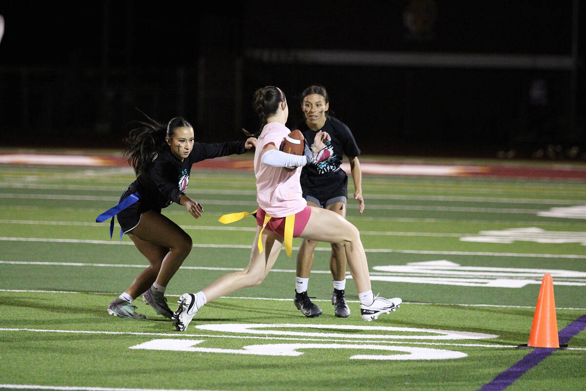 Pahrump Valley High School sophomore Sedona Norton advances the ball up field during the Powder ...