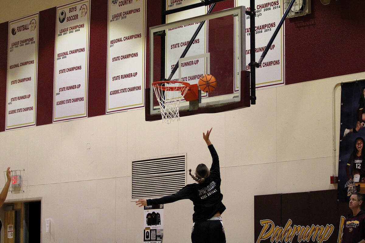 Pahrump Valley High School freshman Raegan Saldana attempts a layup during the varsity girls ba ...