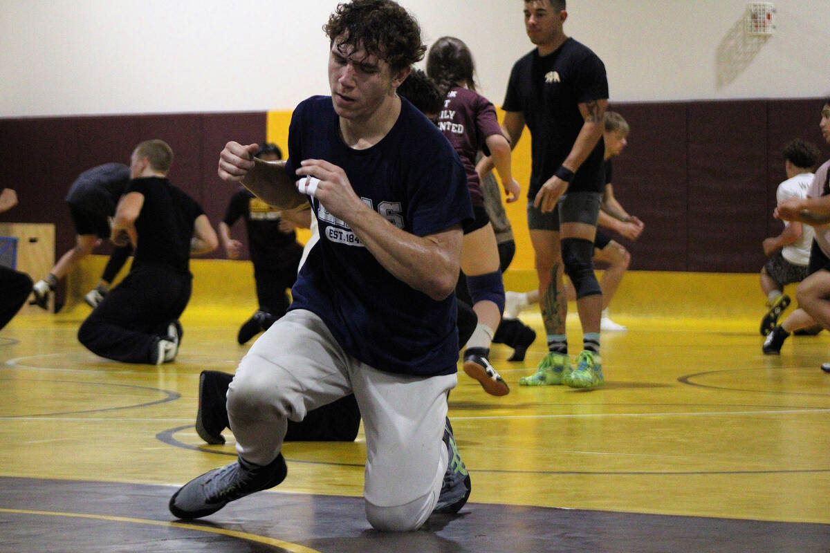 Pahrump Valley High School senior Austin Alvarez practices his sweeps during practice to get re ...