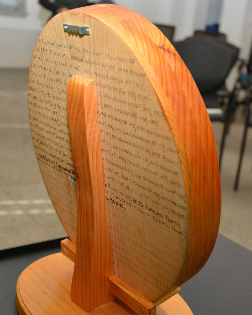 The engraving on the back of the U.S. Capitol Christmas Tree plaque lists each of the forests t ...