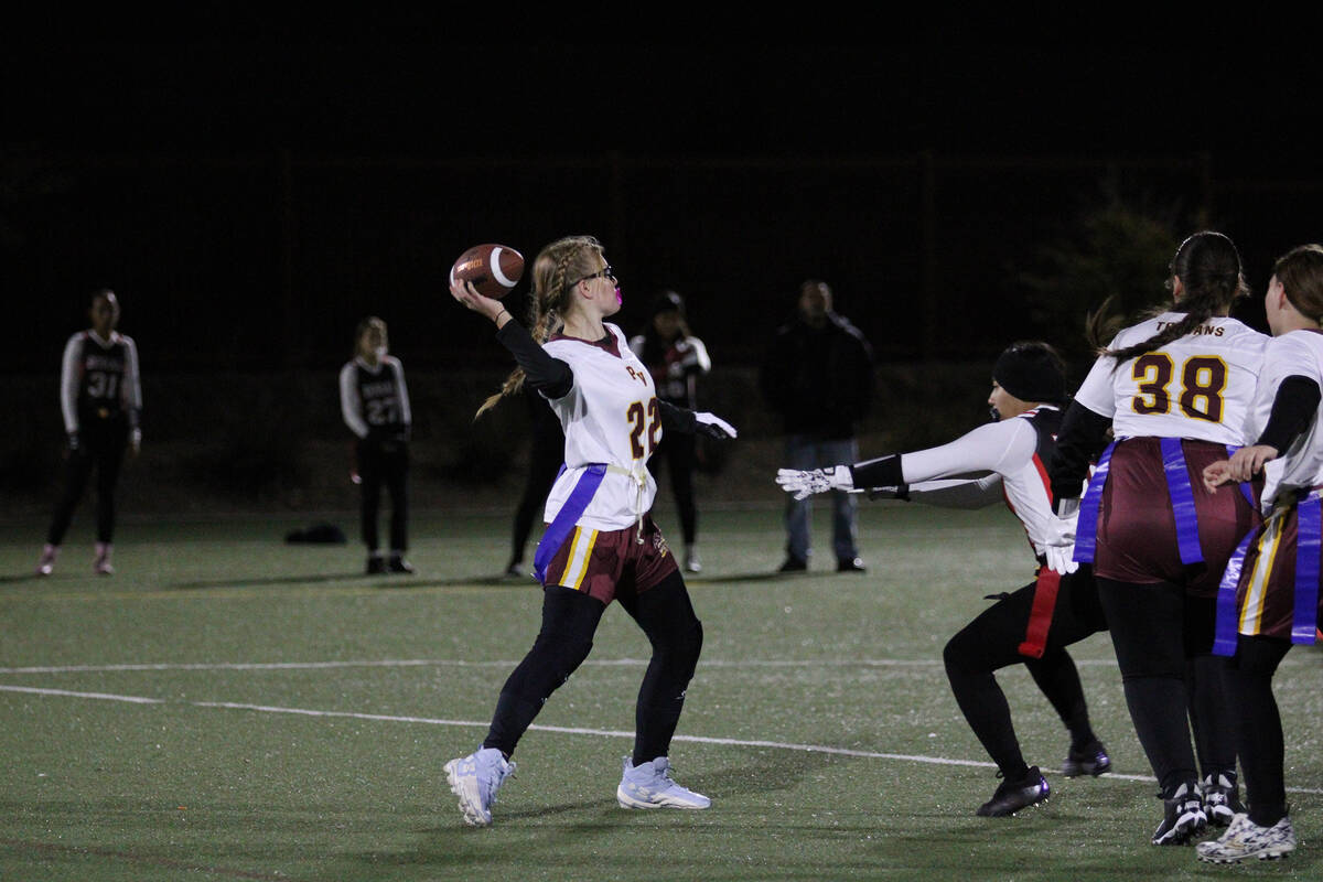 Pahrump Valley High School senior QB/WR Savannah Thompson drops back to let a pass off in the T ...