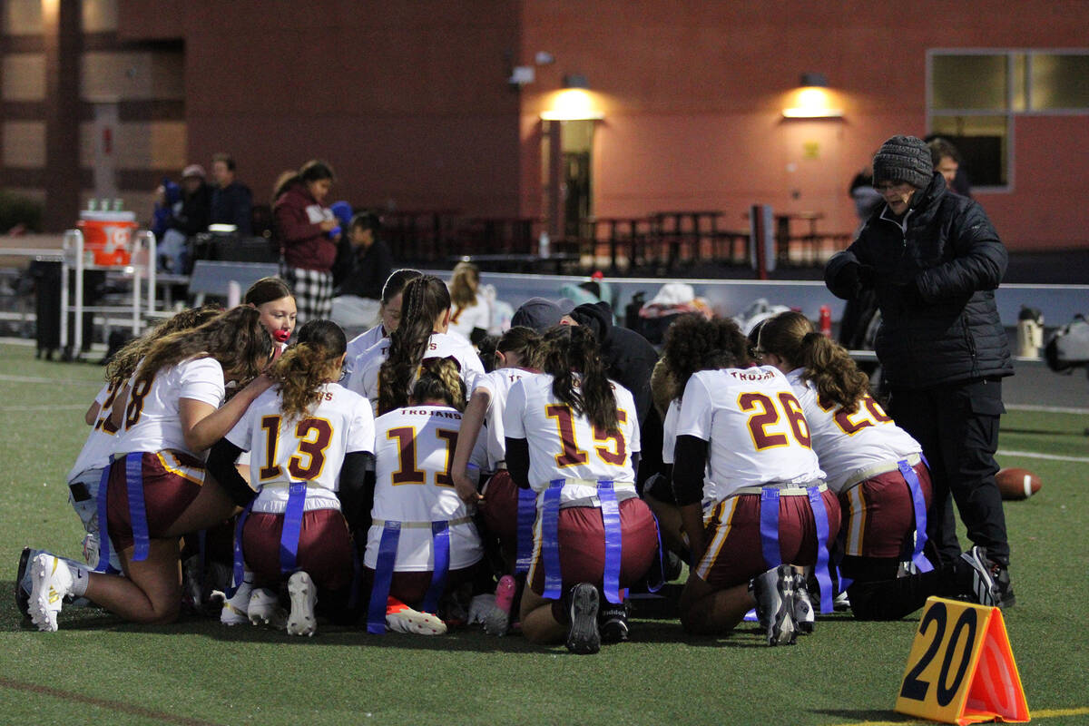 The Pahrump Valley High School flag football team gathers for a prayer to ensure their safety b ...