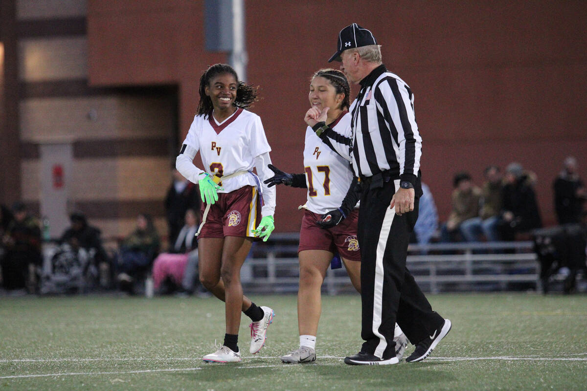 Pahrump Valley High School senior Diona Nixon and sophomore Ariana Lozoya walk out with a refer ...
