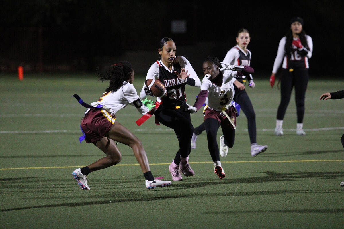 Pahrump Valley High School flag football players senior Diona Nixon and freshman Ma'liyah Colli ...