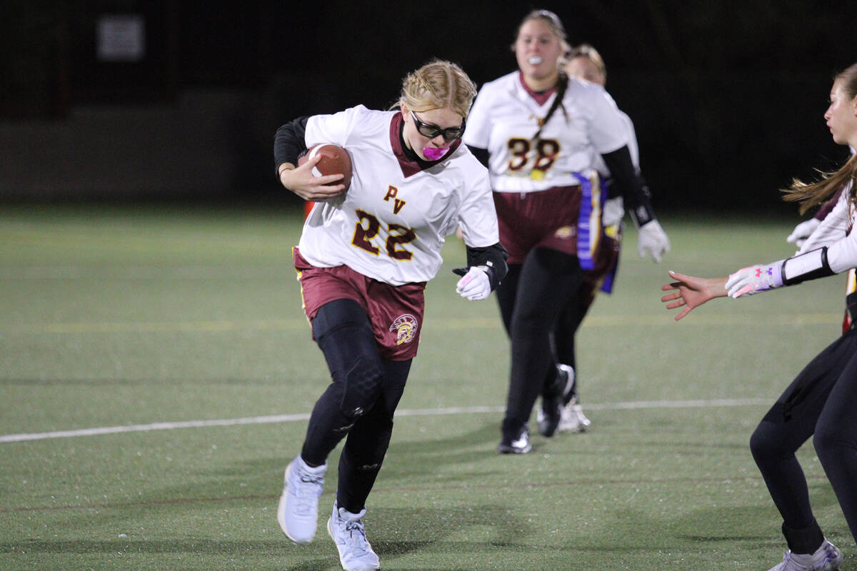 Pahrump Valley High School senior QB/WR Savannah Thompson takes off with the ball following a b ...