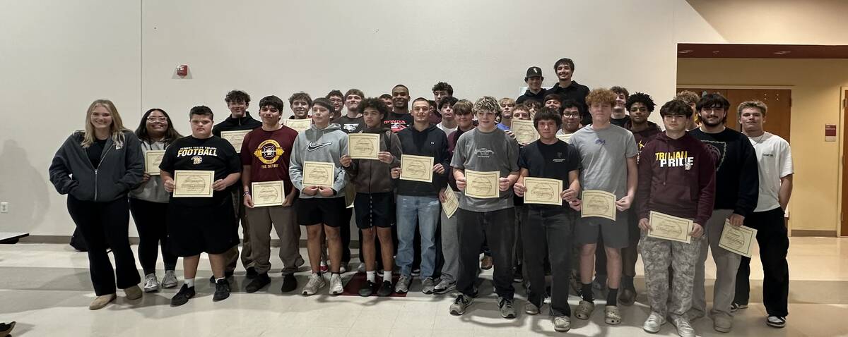 The Pahrump Valley High School varsity football team gathers together for one last team photo o ...