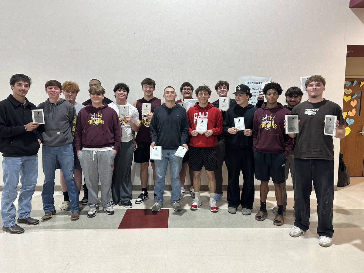 Members of the Pahrump Valley High School varsity football team proudly display their end of th ...