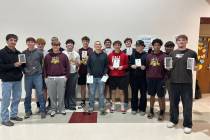 Members of the Pahrump Valley High School varsity football team proudly display their end of th ...