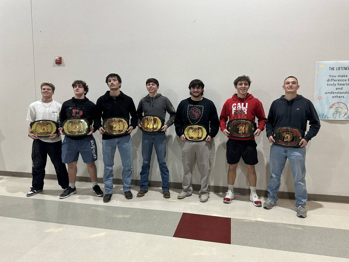 Departing seniors of the Pahrump Valley High School varsity football team show off their "We Ai ...