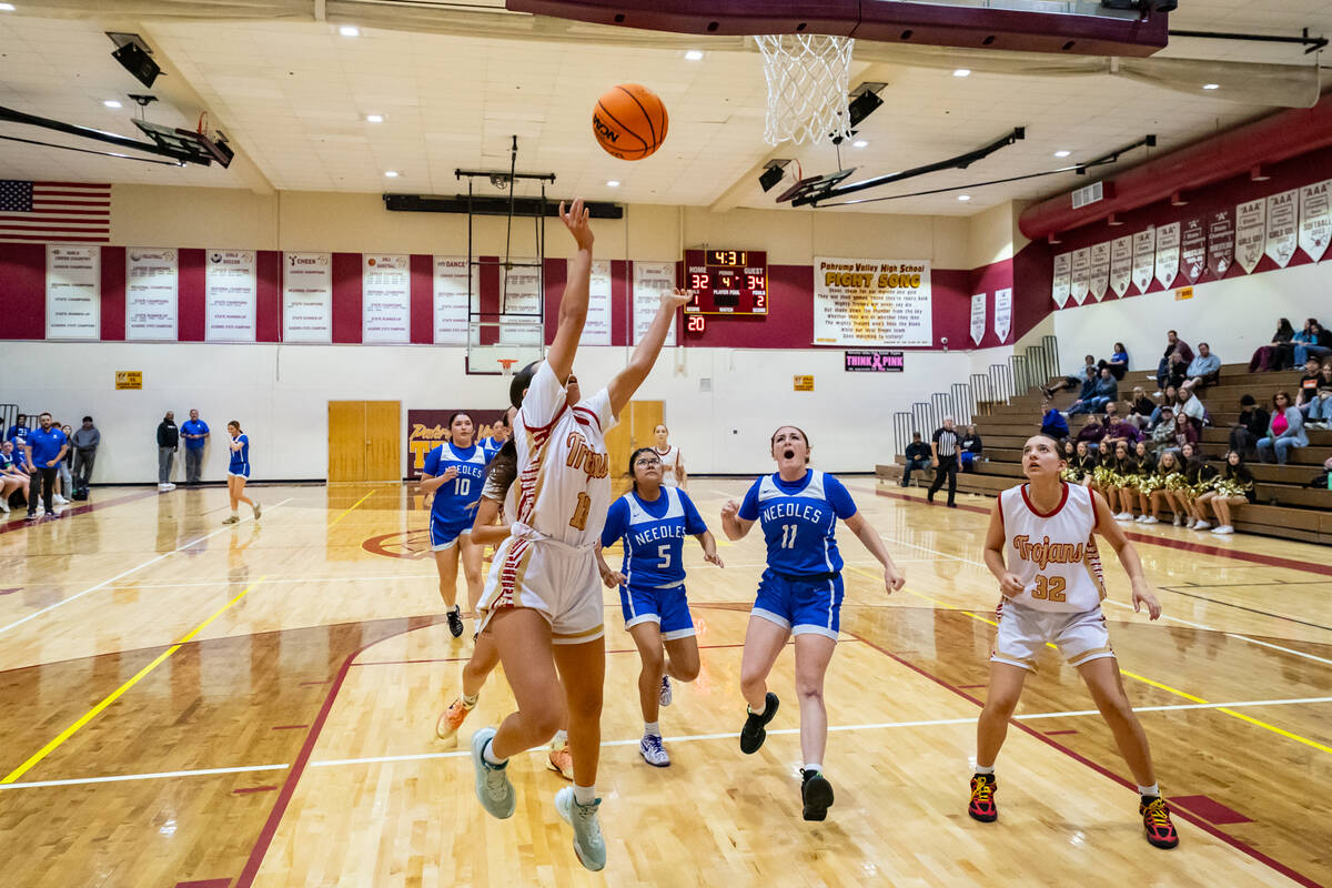 Pahrump Valley High School varsity girls basketball junior guard Autumn Colon attempts a layup ...