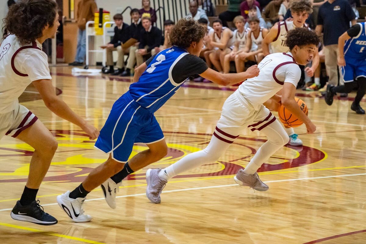 Pahrump Valley High School junior guard Trae Plein breezes past Needles High School senior guar ...