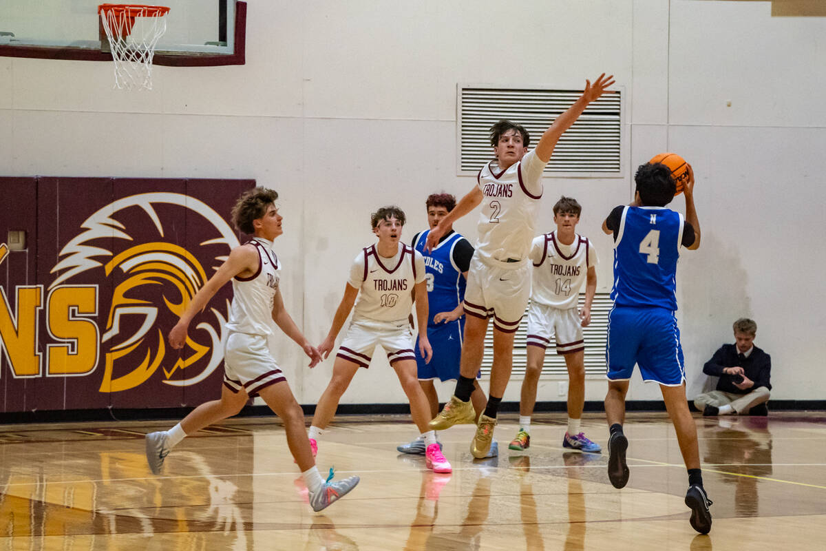 Pahrump Valley High School senior guard Caden Briscoe attempts to intercept a pass from Needles ...
