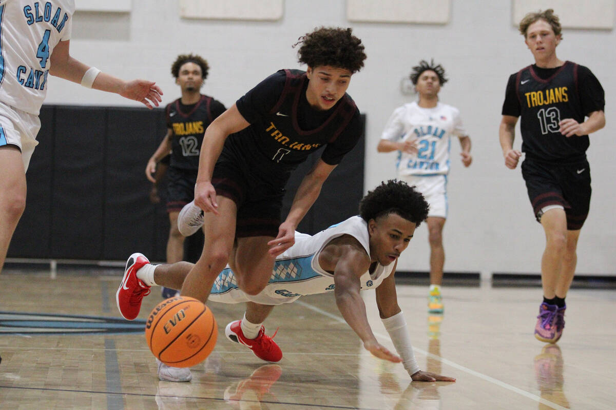 Pahrump Valley High School junior Trae Plein steals the ball away from a Pirates defender durin ...