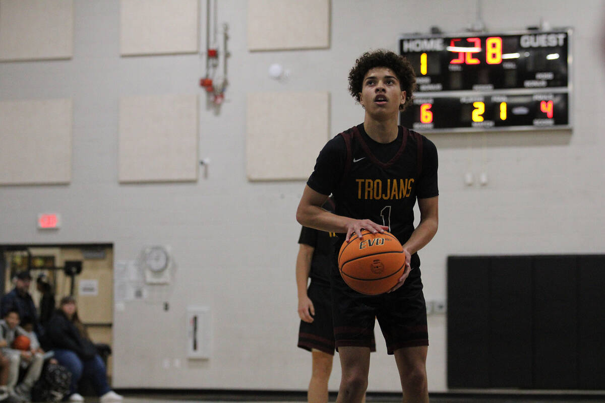 Pahrump Valley High School junior Trae Plein is sent to the free-throw line against the Pirates ...