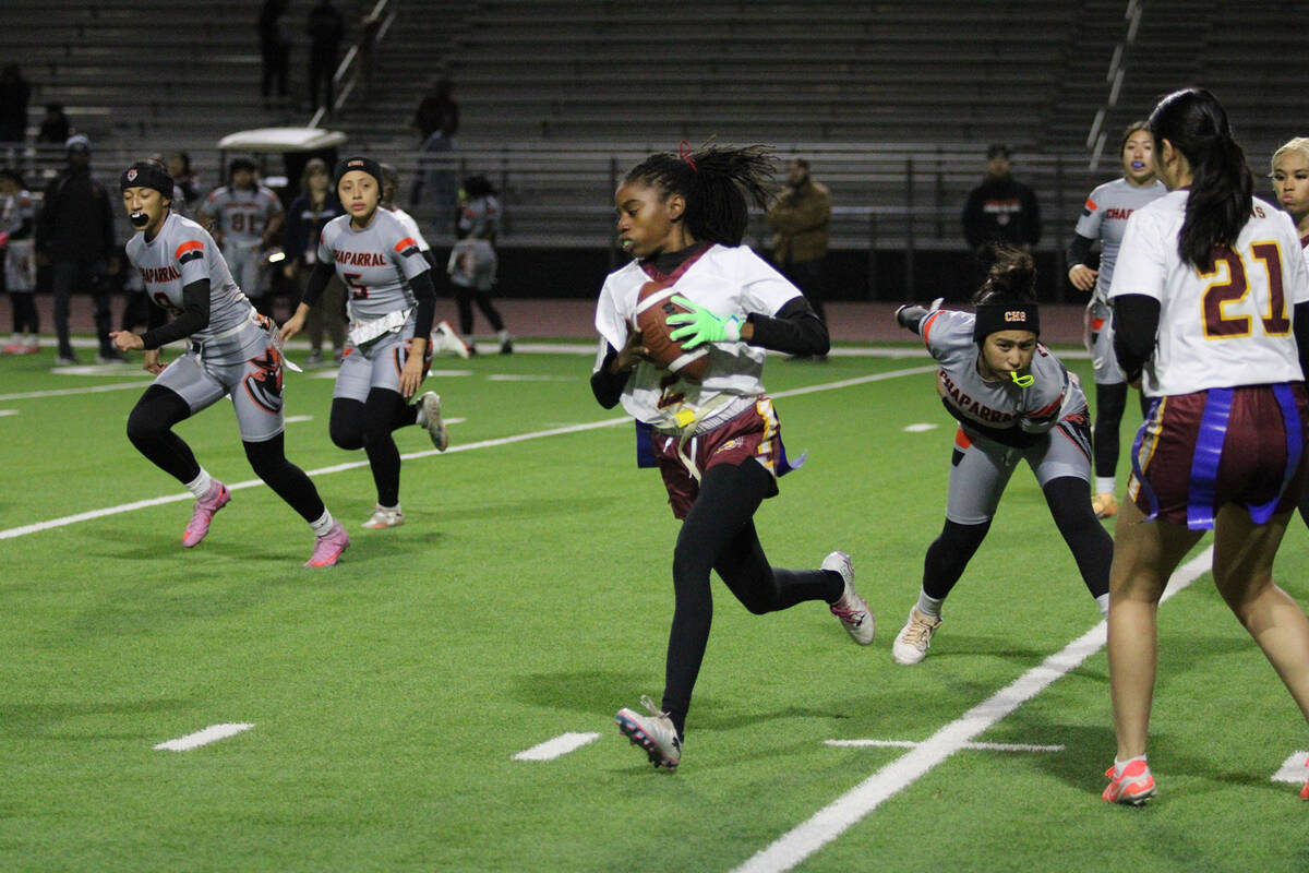 Pahrump Valley High School senior Diona Nixon evades a Chaparral High School defender in the Tr ...