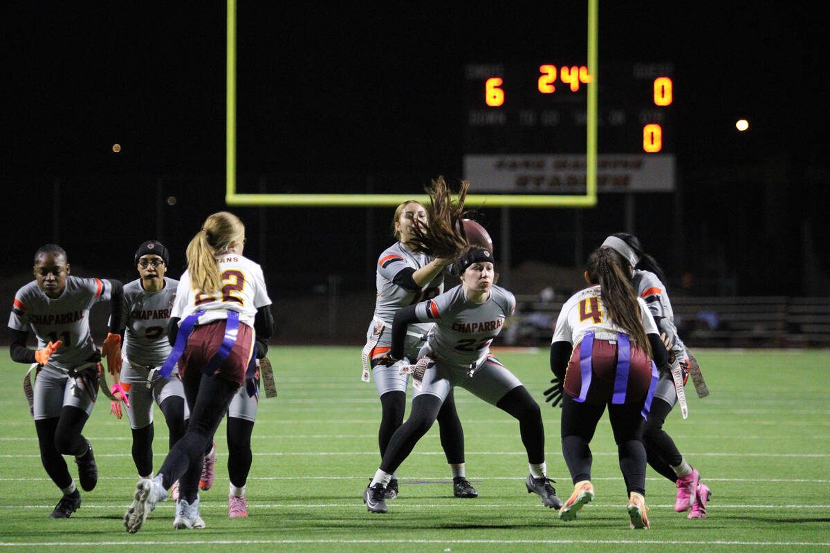 Pahrump Valley High School defenders junior Jazmyn Herrera and senior Savannah Thompson try to ...