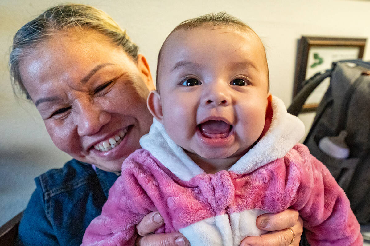 Baby Romi smiles for the Pahrump Valley Times’ camera while her parents are interviewed for t ...
