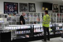 Pahrump Sports Cards shop owner Ernie Desaye asks a customer what he is most interested in the ...