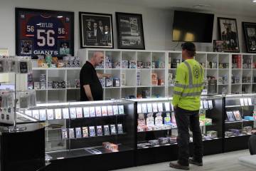 Pahrump Sports Cards shop owner Ernie Desaye asks a customer what he is most interested in the ...