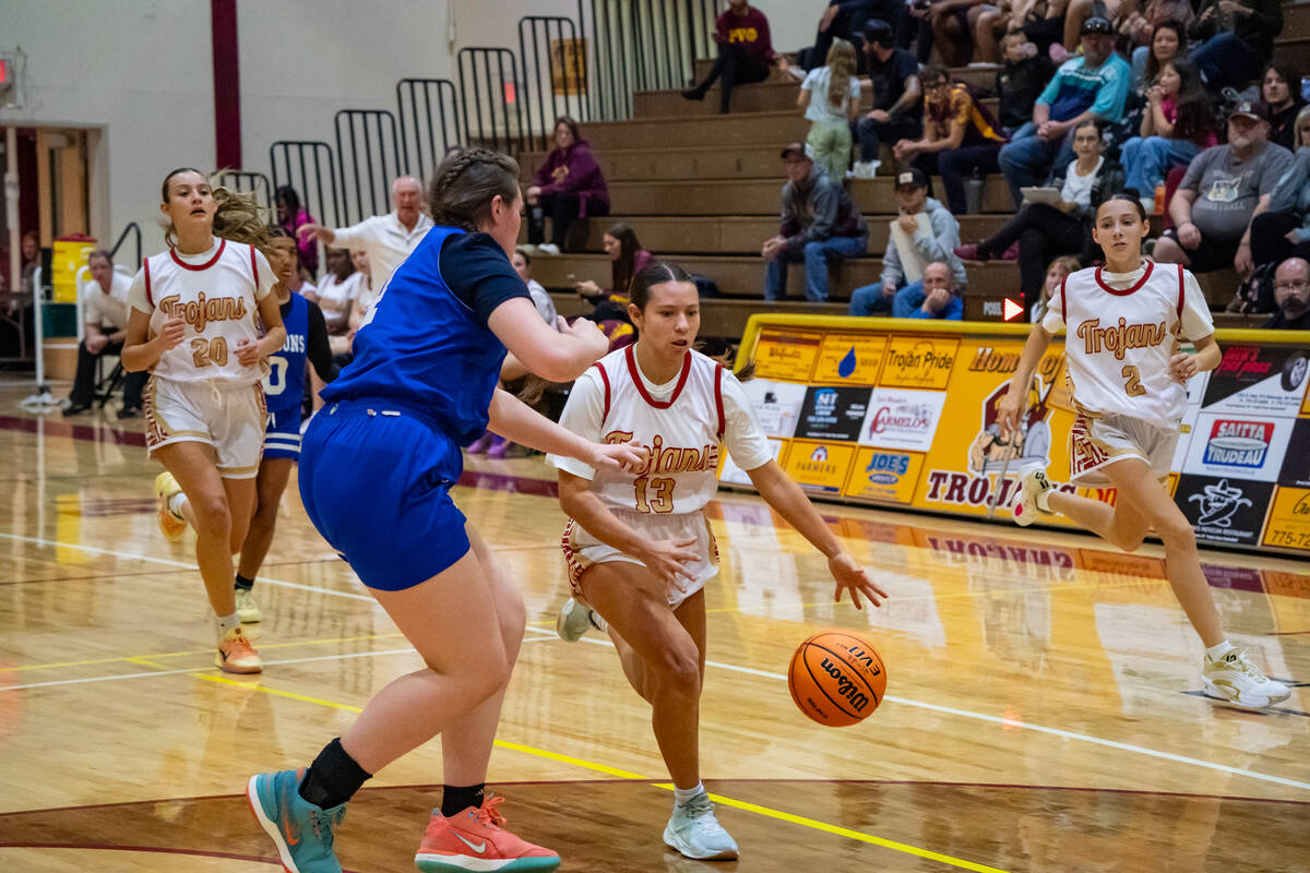 Pahrump Valley High School junior guard Autumn Colon breezes past a Coral Academy of Science La ...