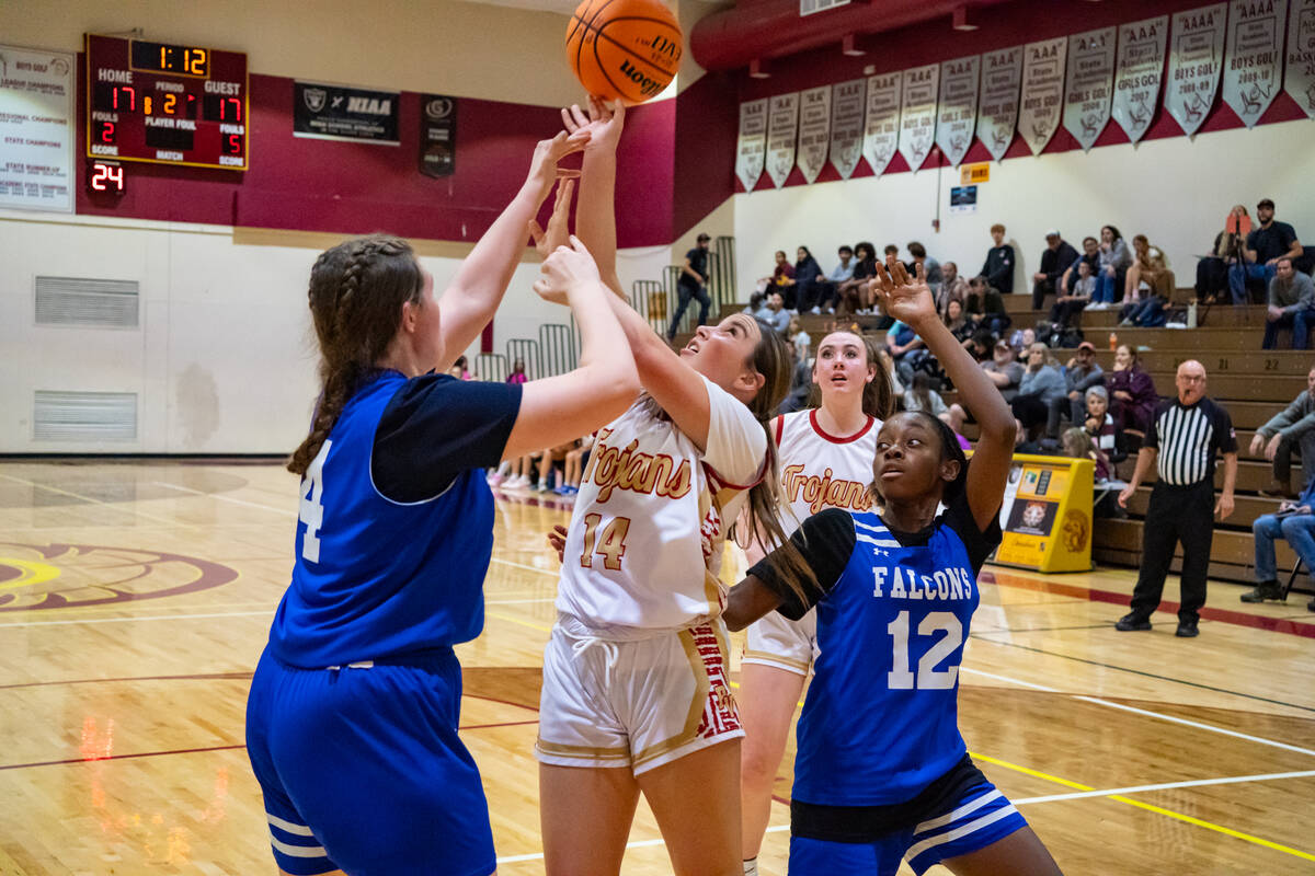 Pahrump Valley High School junior guard Sydney Crotty battles for possession of the ball during ...