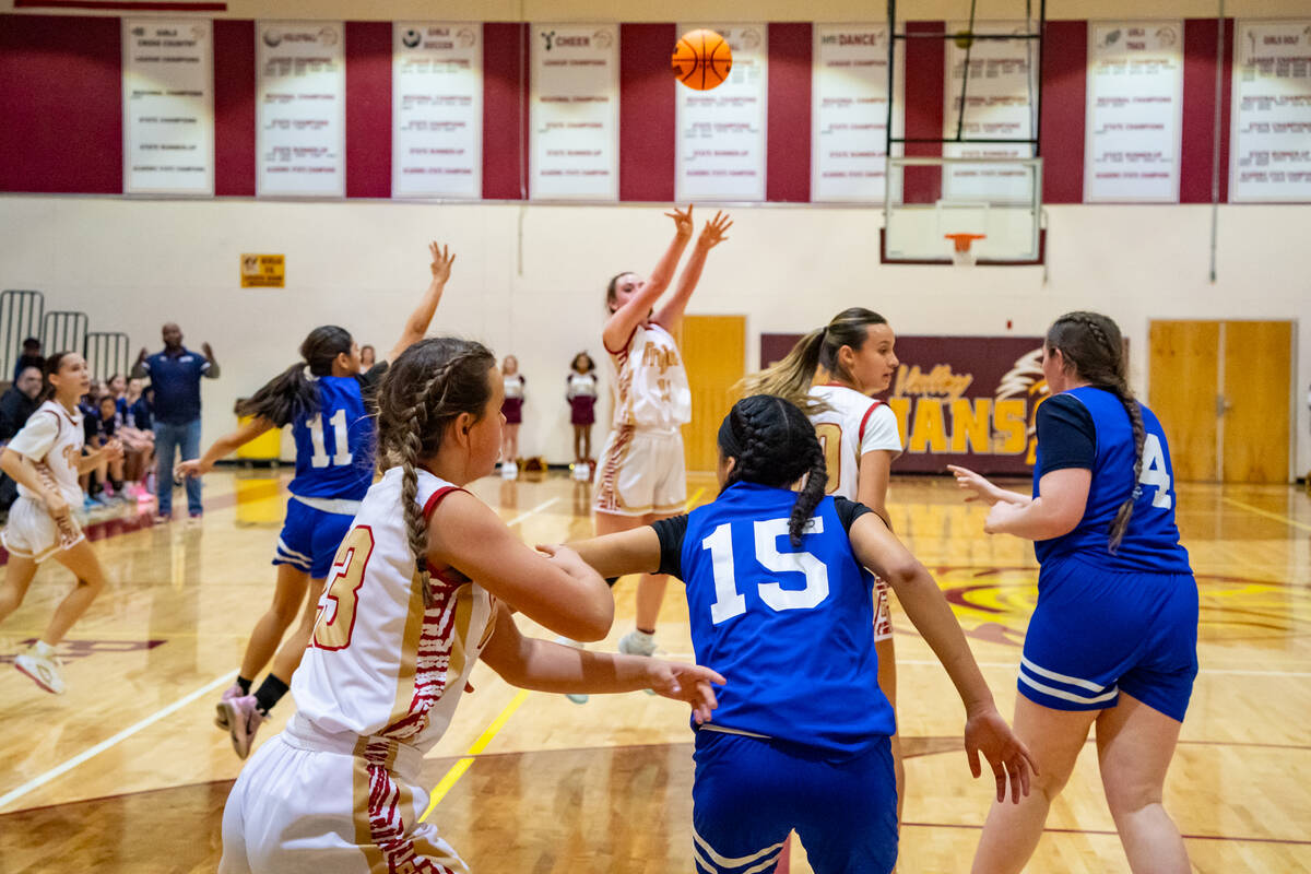 Pahrump Valley High School sophomore Kaitlyn Brown launches a three from deep during the Trojan ...