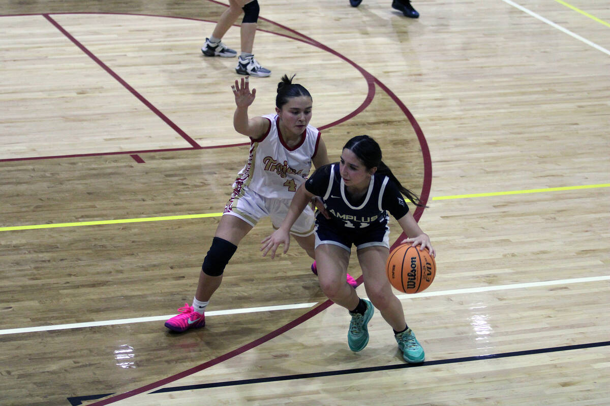 Pahrump Valley High School girls sophomore guard Aurora Bowers plays man defense on a Amplus Ac ...