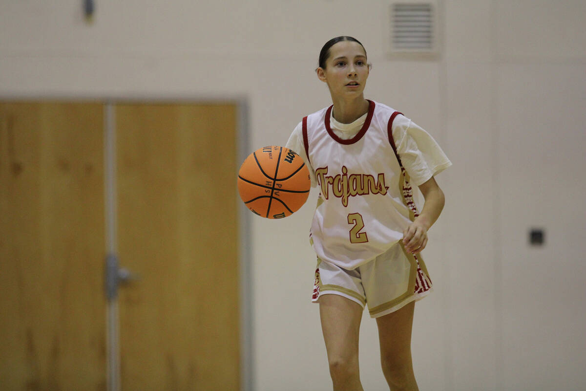 Pahrump Valley High School sophomore guard Addi Nelsen advances the ball up court in the Trojan ...