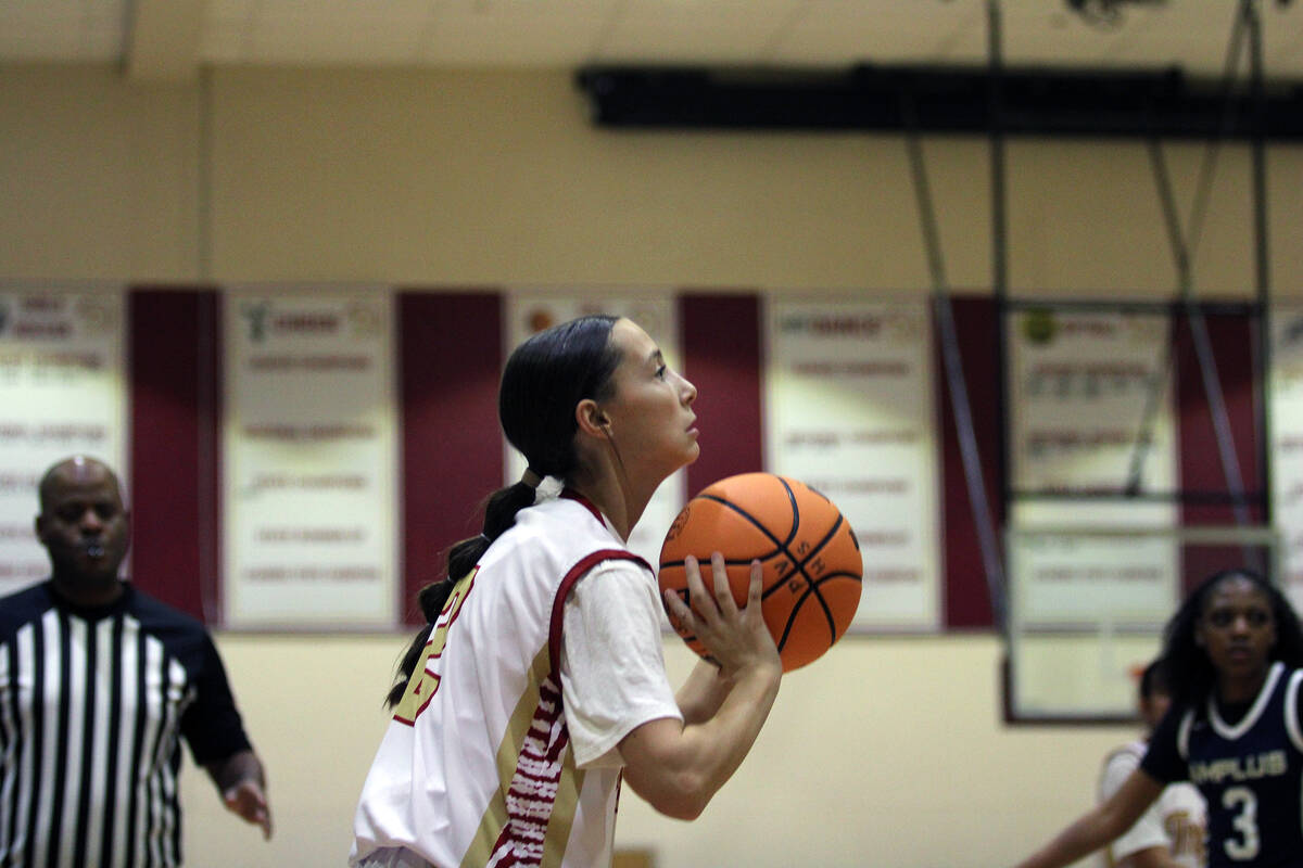 Pahrump Valley High School sophomore guard Addi Nelsen prepares to shoot a three-pointer in the ...
