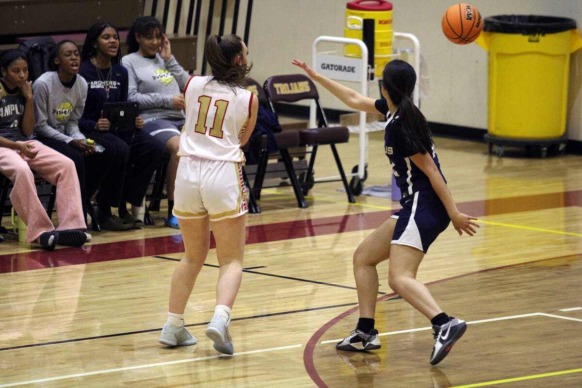 Pahrump Valley High School sophomore Kaitlyn Brown heaves a pass over to the corner for an assi ...