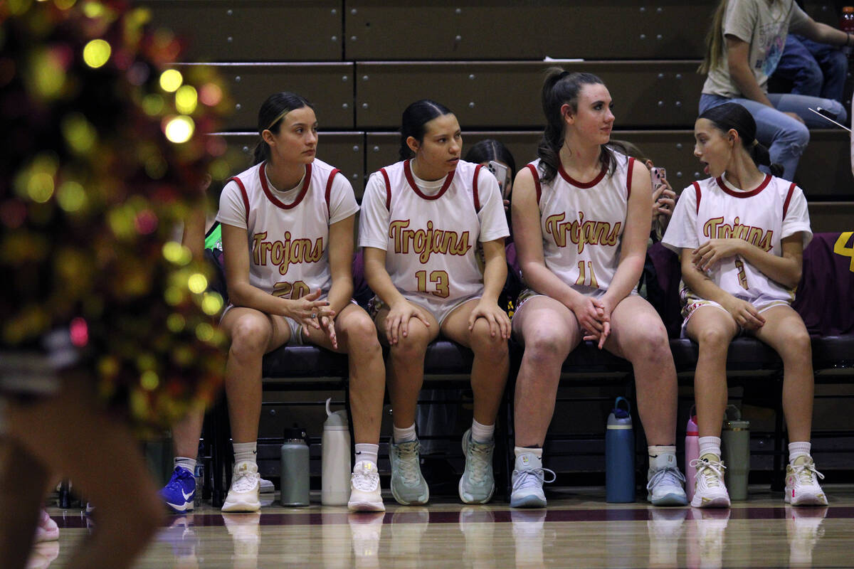 Lady Trojans Riley Saldana (left), Autumn Colon (middle left), Kaitlyn Brown (middle right) and ...