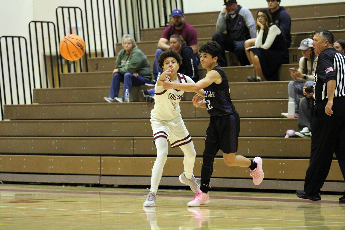 Pahrump Valley High School junior guard Trae Plein tries his best to contest a pass from GV Chr ...