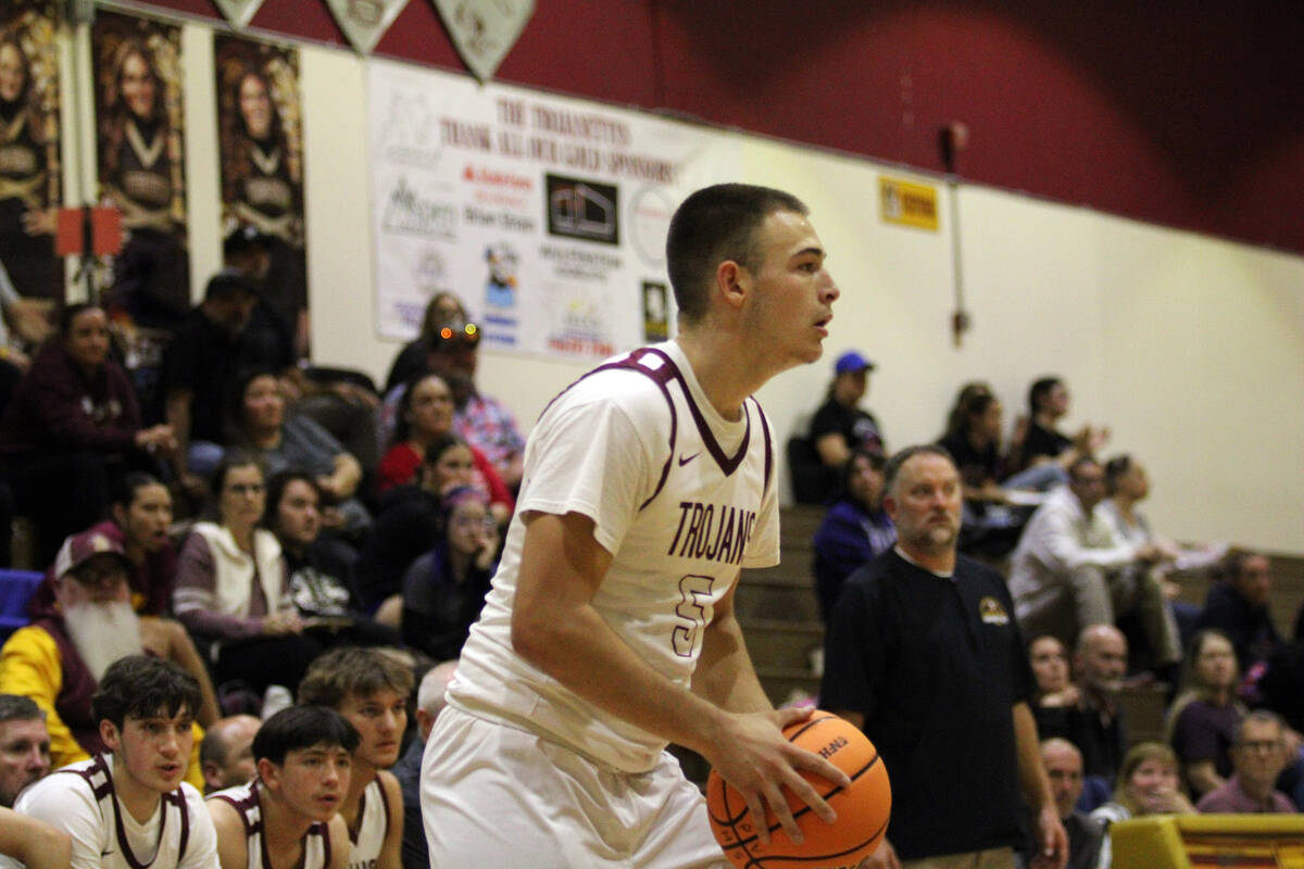 Pahrump Valley High School senior Joshua Slusher sets up for a jumper in the Trojans home leagu ...