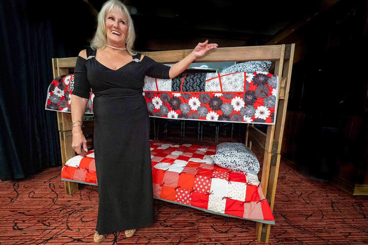Nye County Sleep in Heavenly Peace President Carmen Murzyn poses before a sample of a bunk bed ...