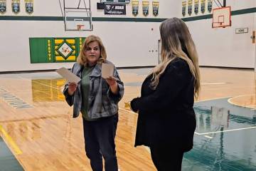 Beatty VFW General Manager Carlotta Marinaro (left) presents the donation to Beatty High teache ...