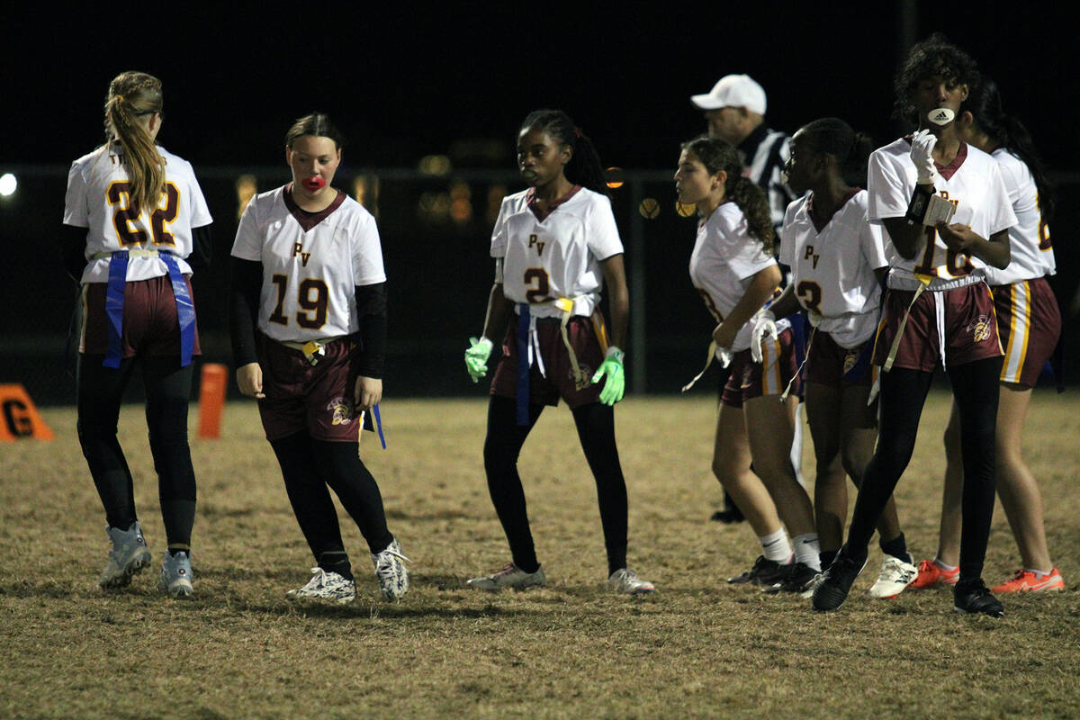 The Pahrump Valley High School flag football team comes out of their huddle during during the g ...
