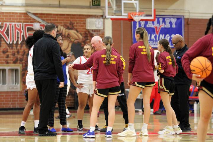 Pahrump Valley High School head coach Bob Hopkins greets opponents from Valley High School befo ...