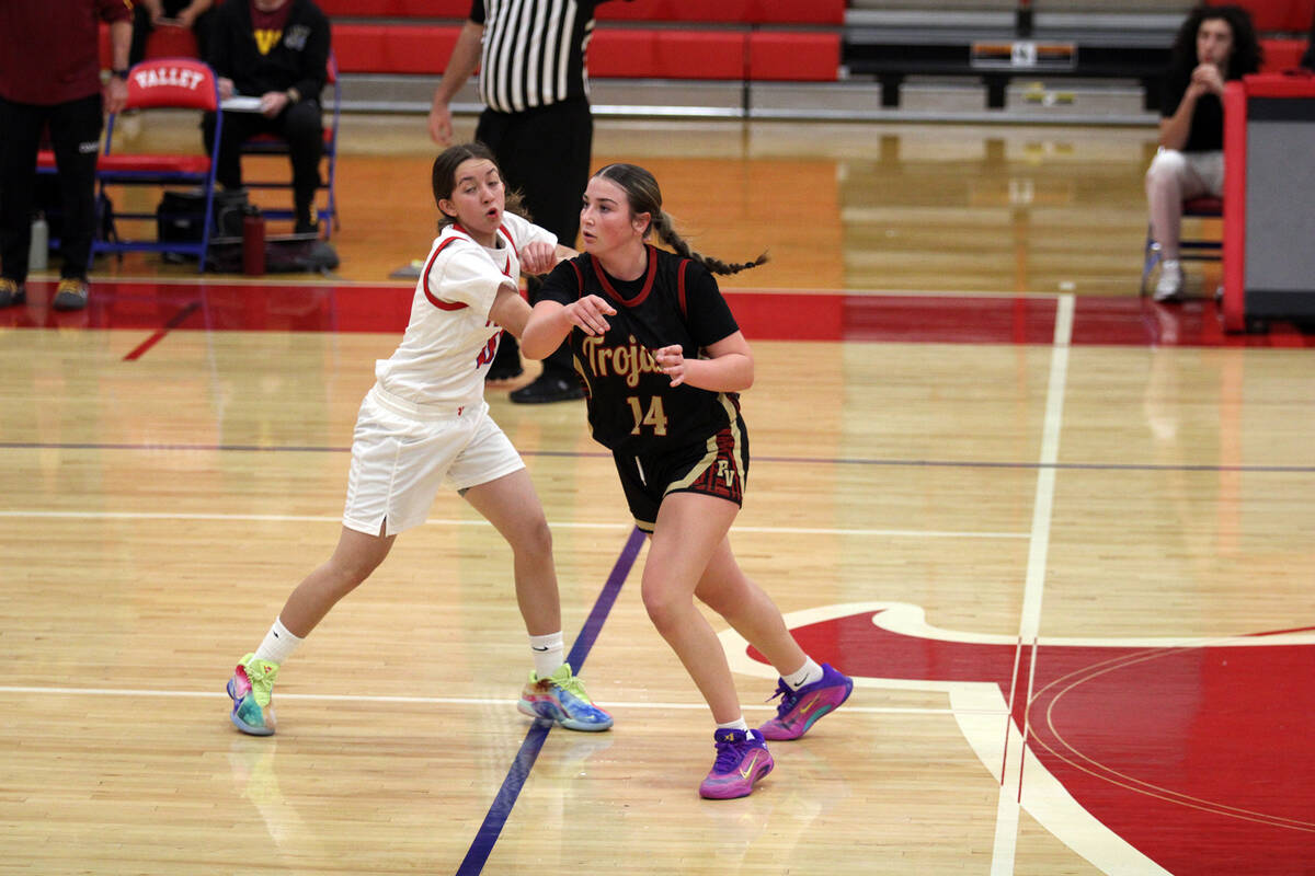 Pahrump Valley High School junior Sydney Crotty does her best to get off a Valley High School d ...