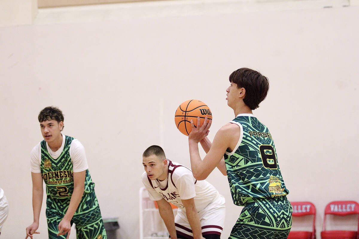 Pahrump Valley High School senior forward Joshua Slusher looks on as a 1st Nations Polynesian p ...