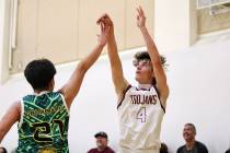 Pahrump Valley High School senior Keir Sheppard launches a shot over a 1st Nations Polynesian d ...