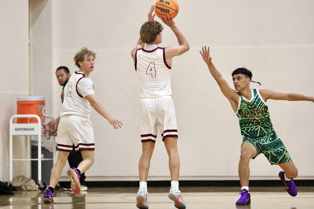 Pahrump Valley High School senior Kier Sheppard pulls up from beyond the arch to drain a three ...
