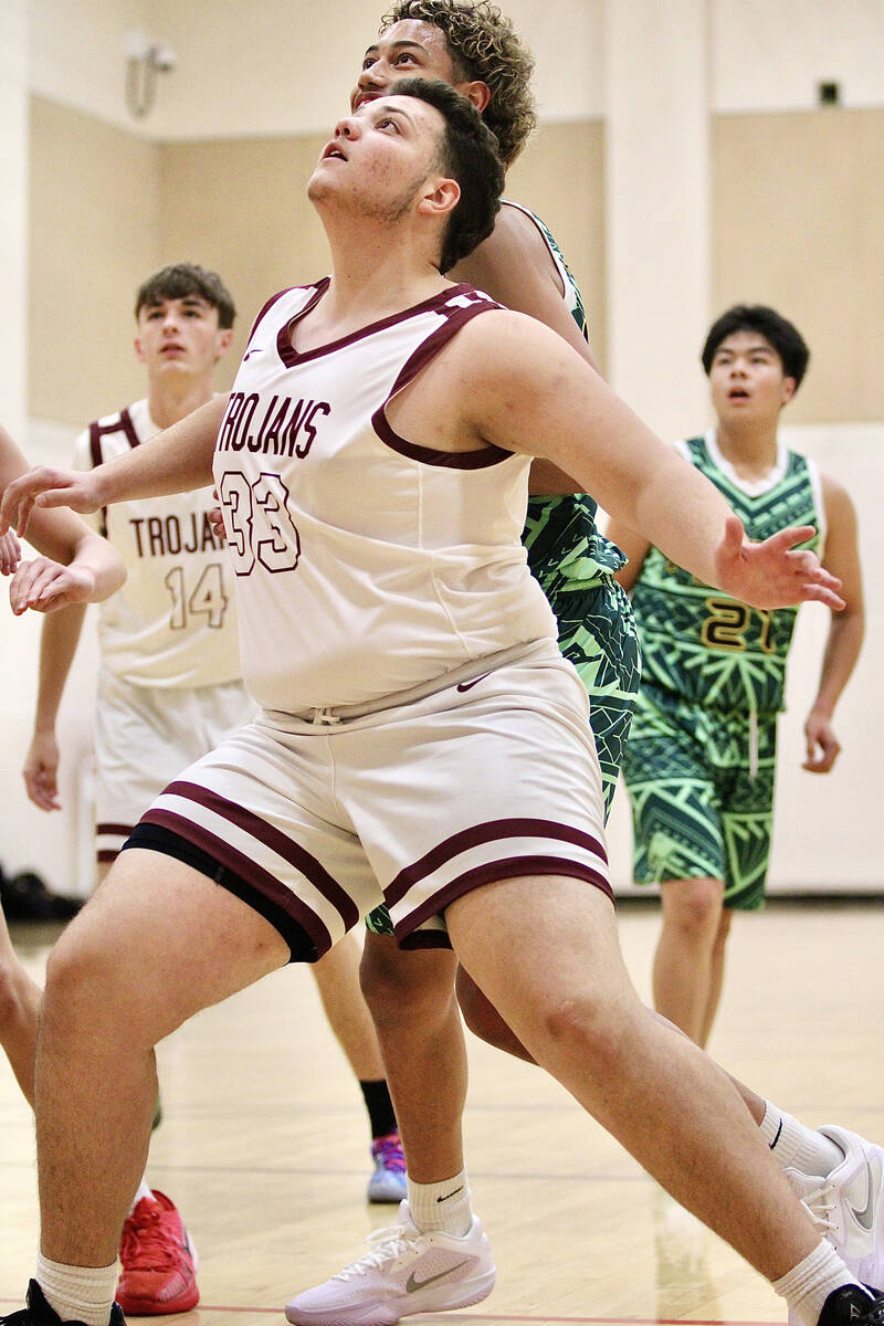 Pahrump Valley High School junior Luca Blundo boxes out a 1st Nations Polynesian defender durin ...