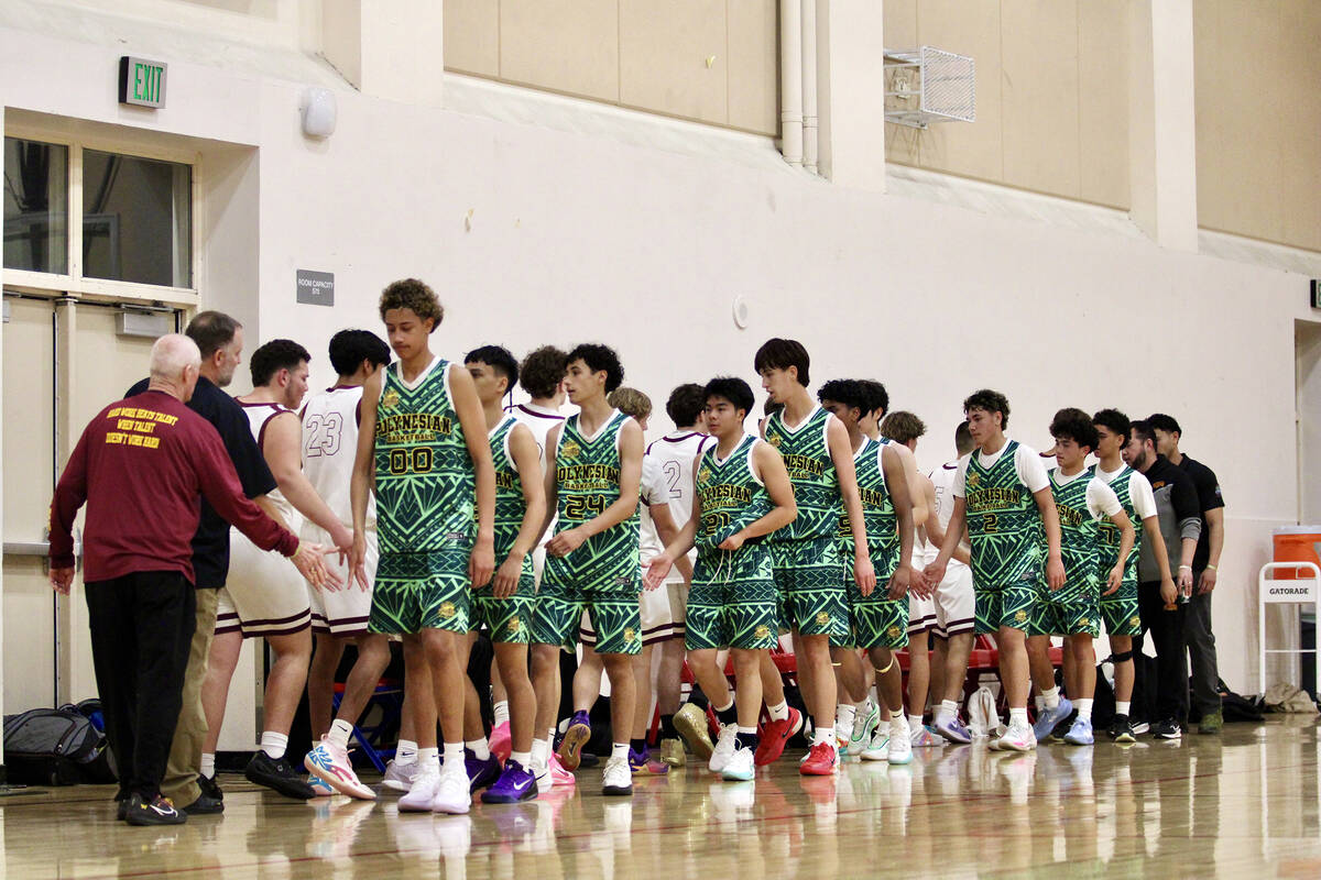 Members of both programs exchange good sportsmanship following the conclusion of the first game ...