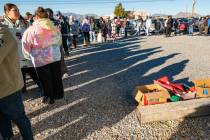 A line of more than 50 parents and grandparents that signed up to select toys for their kids an ...