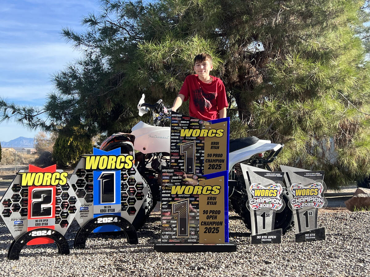 Pahrump local WORCS Racing champion Kroi Ryan proudly stands with his multiple WORCS championsh ...