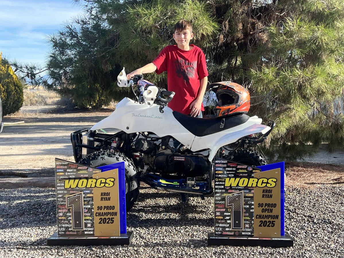 Pahrump local WORCS Racing champion Kroi Ryan poses with his 90 Production Champion trophy and ...