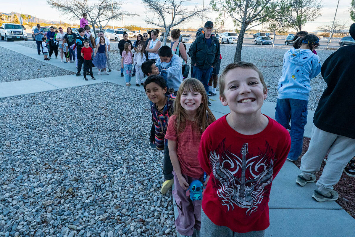 A large line of approximately 50 people was waiting outside of the Nye County Sheriff’s Offic ...