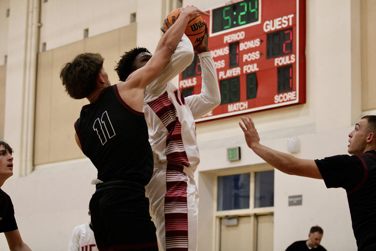 Pahrump Valley High School senior center Aydon Veloz gets a hand on the ball against an Innovat ...